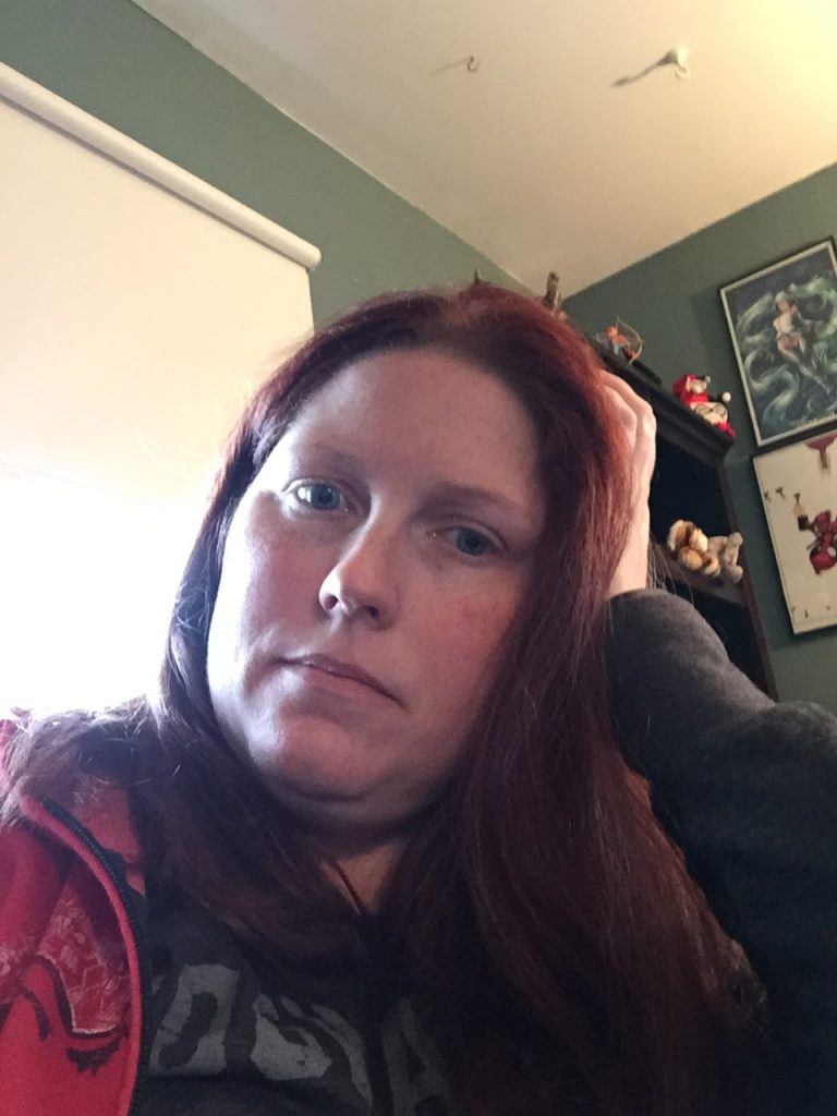 A person looking at the camera

Description automatically generated